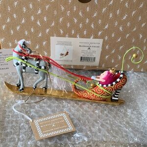 Mackenzie-Childs “Jingle  Bell Sleigh” Ornament with Gold and Red Details.